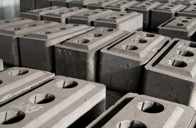 Background image of concrete bricks set for shipping at factory, copy space