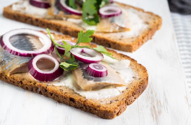 Danish open sandwich smorrebrod with salted herrinÿØÿà