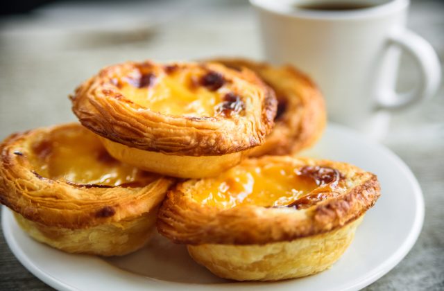 Portugal Egg tarts Pastel de Nata serving on plate with coffee